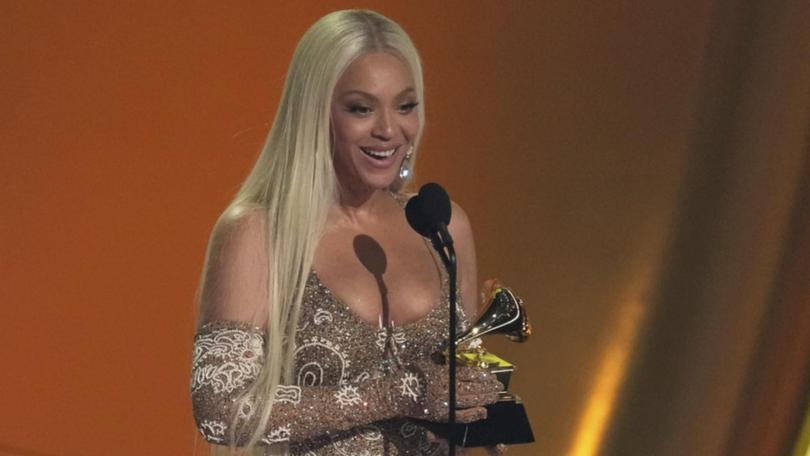 Beyonce accepts the Grammy for best country album for Cowboy Carter. 