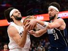 Cleveland Cavaliers guard Max Strus (drives to the basket against Dallas Mavericks guard Klay Thompson.