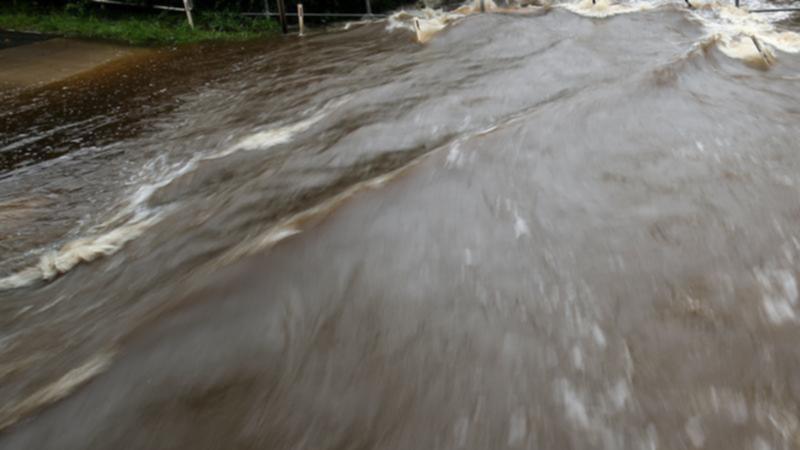 Two men who couldn't swim died when they disappeared off the back of a ute into a flooded creek. (Brendon Thorne/AAP PHOTOS)