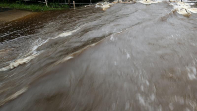 Two men who couldn't swim died when they disappeared off the back of a ute into a  flooded creek. (Brendon Thorne/AAP PHOTOS)