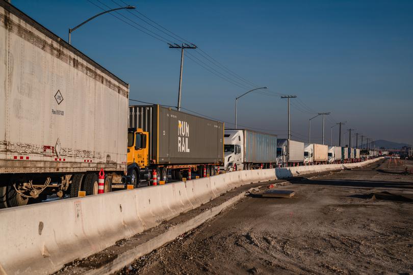 Freight trucks queue to enter Mexico via the border crossing in the Otay Mesa neighborhood of San Diego, on Saturday, Feb. 1, 2025. 