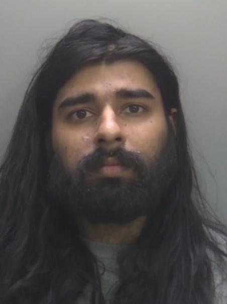 Hari Mann was wearing a high-vis jacket and carrying a fake automatic weapon.