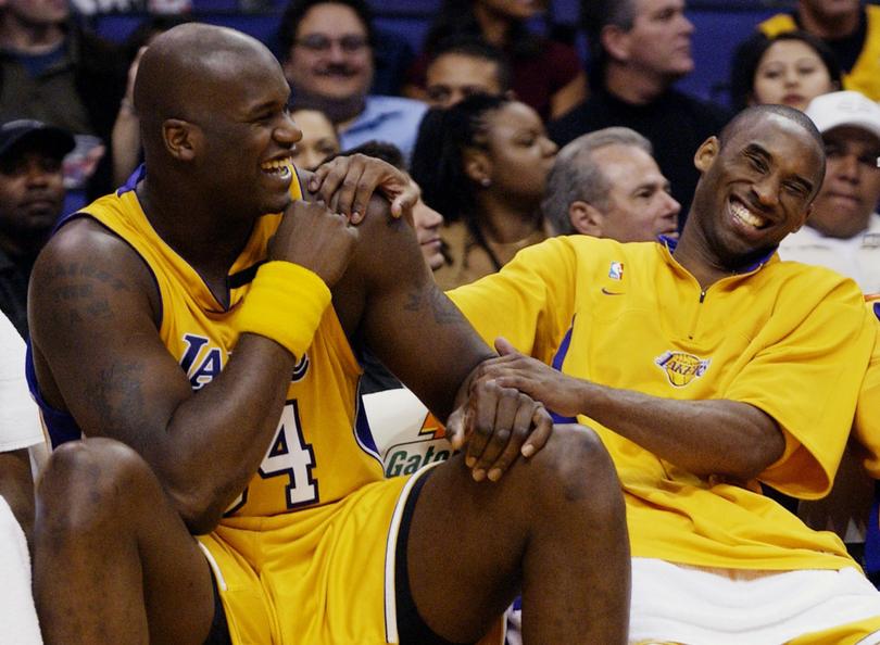 Shaquille O'Neal and Kobe Bryant share a laugh in 2003. 