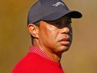 Tiger Woods credited his mother with his signature red shirt for the final rounds.