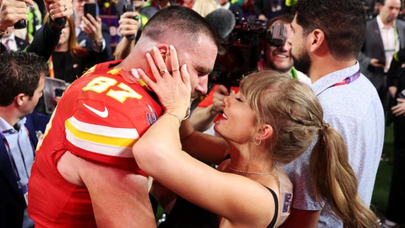 Travis Kelce and Taylor Swift embrace on the field after Kansas City won last year’s Super Bowl.