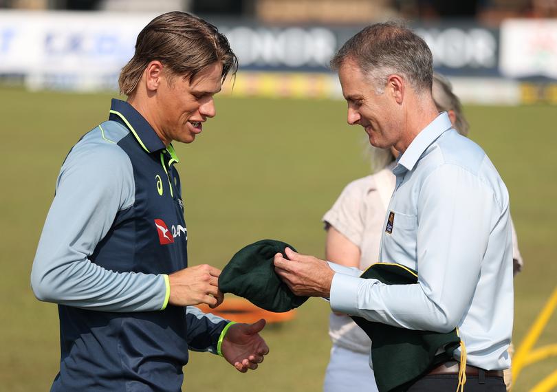 GALLE, SRI LANKA - FEBRUARY 06: Cooper Connolly of Australia is presented with his cap by Simon Katich after he was named as a debutant during day one of the Second Test match in the series between Sri Lanka and Australia at Galle International Stadium on February 06, 2025 in Galle, Sri Lanka. (Photo by Robert Cianflone/Getty Images)