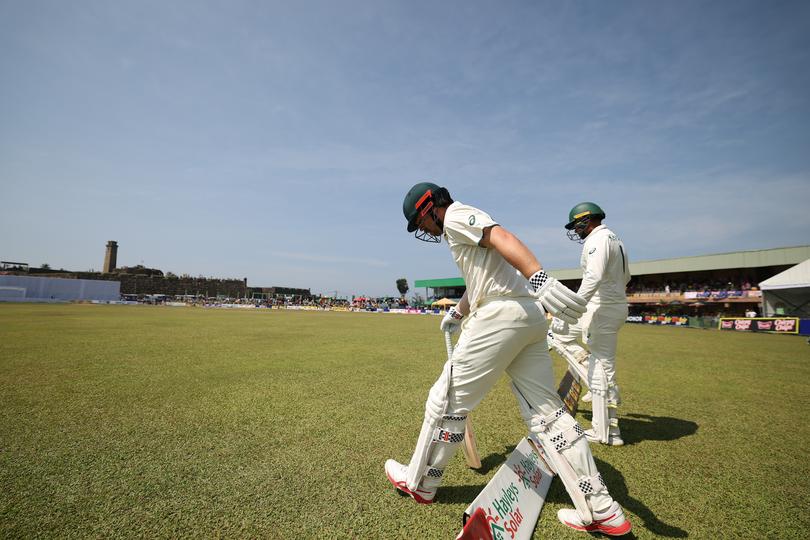 GALLE, SRI LANKA - FEBRUARY 07: Travis Head and Usman Khawaja of Australia head out to bat during day two of the Second Test match in the series between Sri Lanka and Australia at Galle International Stadium on February 07, 2025 in Galle, Sri Lanka. (Photo by Robert Cianflone/Getty Images)