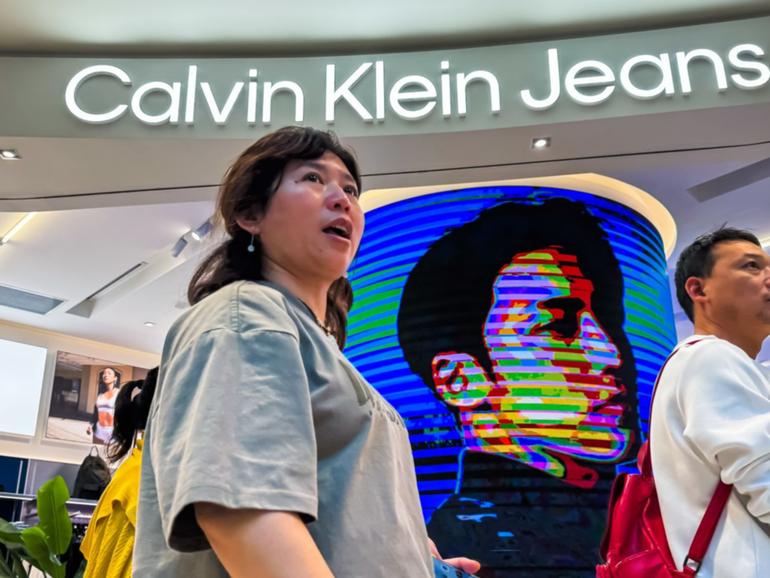 People shop for clothes at a Calvin Klein store at a mall in Beijing on Feb. 5, 2025.