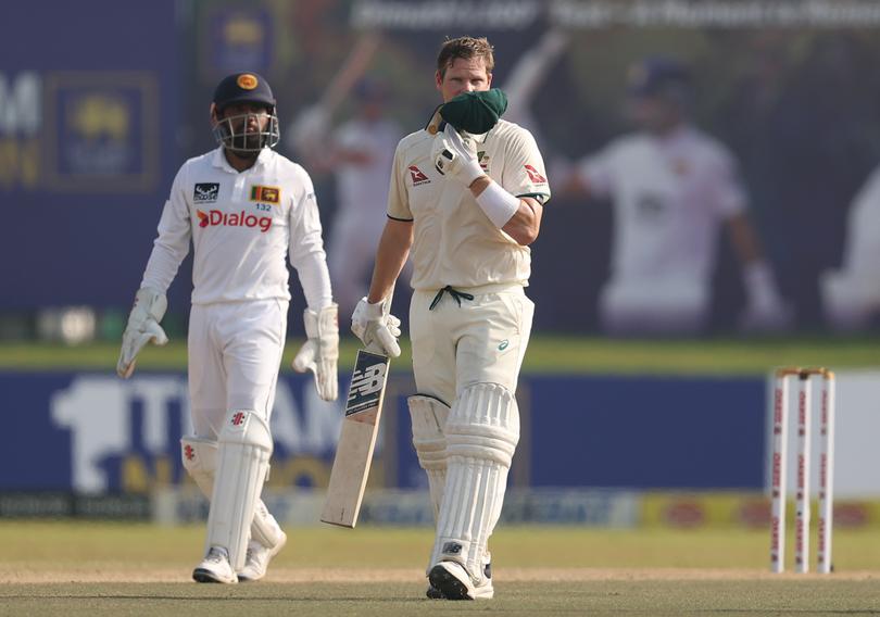 Steve Smith celebrates after scoring a century.