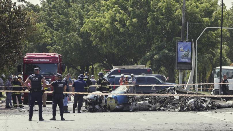 A small aircraft crashed in a busy Sao Paulo street, hitting a bus and killing two people. 