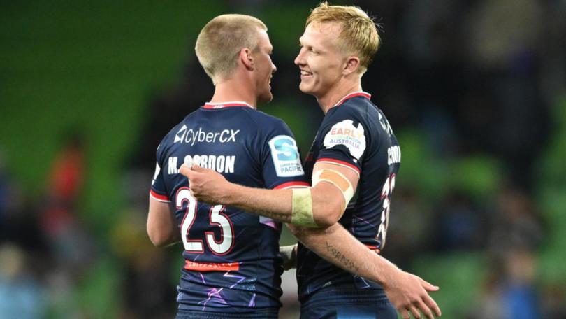 Mason Gordon (l) pondered following brother Carter (r) to league but is glad he landed at the Reds. 