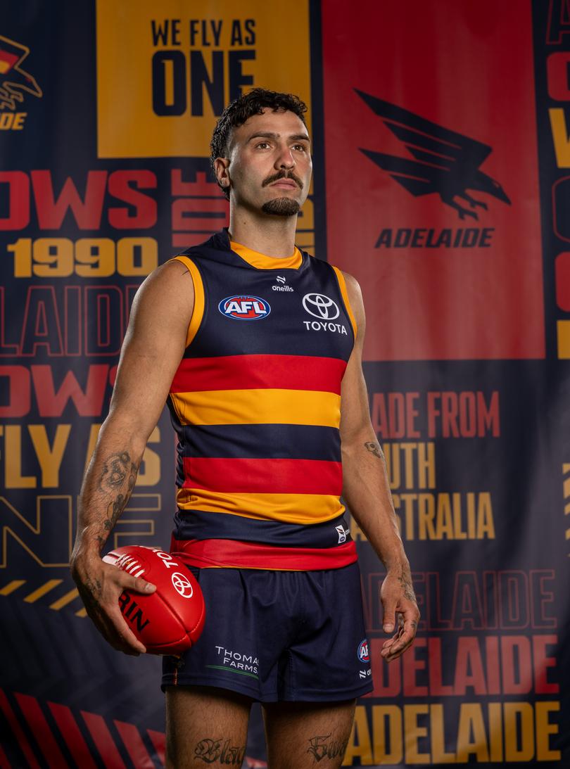 Izak Rankine with Adelaide’s new logo.