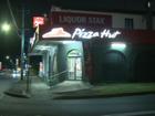 The Guildford Pizza Hut was robbed before one of the thieves returned the money back to the store