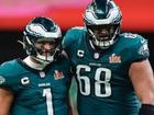 Eagles quarterback Jalen Hurts celebrates with Aussie teammate Jordan Mailata.