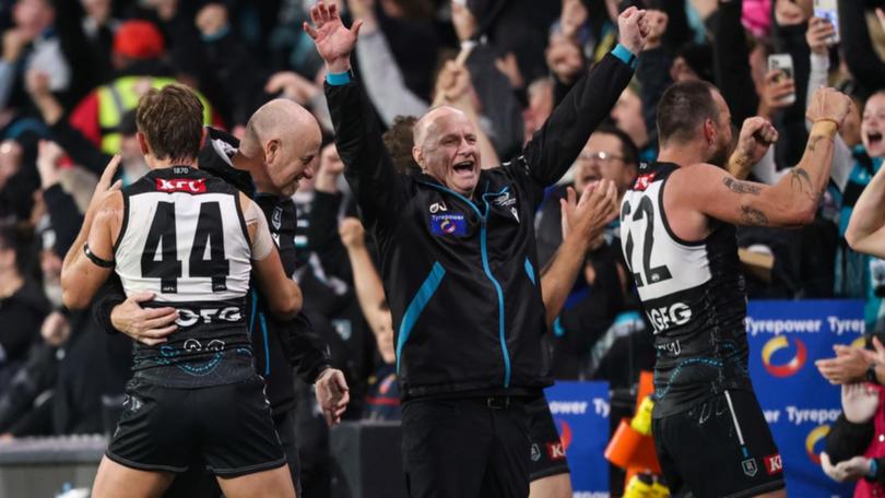 Port Adelaide coach Ken Hinkley (centre) will hand over the reins at the end of the season.  (Matt Turner/AAP PHOTOS)