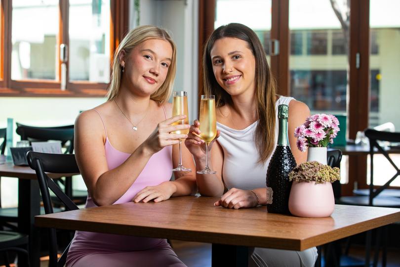 Poppy Ioannakis (white) and Grace Jensen (pink) enjoying Galentines Day at Catalano Family Kitchen in Perth.