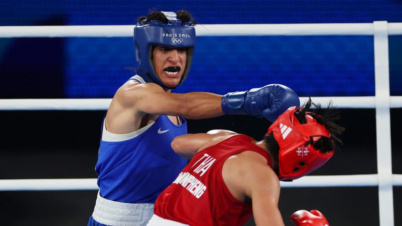 PARIS, FRANCE - AUGUST 06: Imane Khelif hits Thai boxer Janjaem Suwannapheng during the Paris Games.