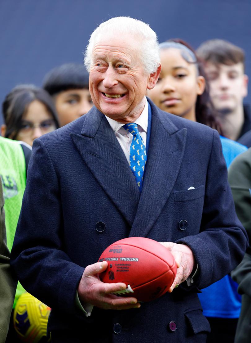  AFTER CREATE DATE AND TIME) King Charles III is presented with an American football from Super Bowl LIX.