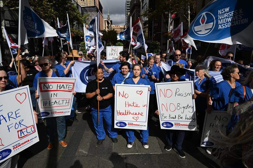 Nurses and medical professionals rally against hate speech in Sydney. 