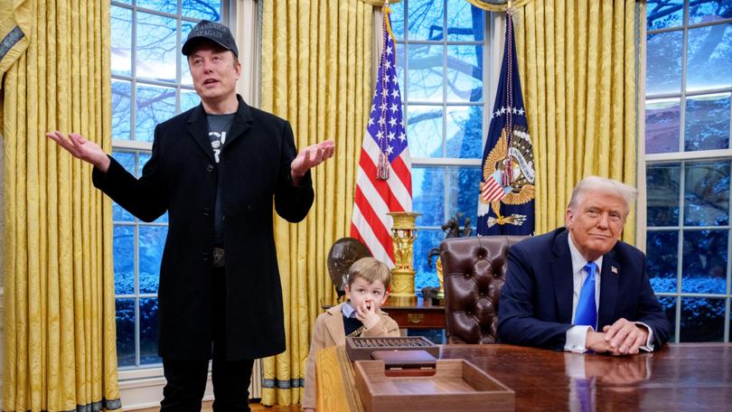 Musk and his son X Musk in the Oval Office with Donald Trump.  