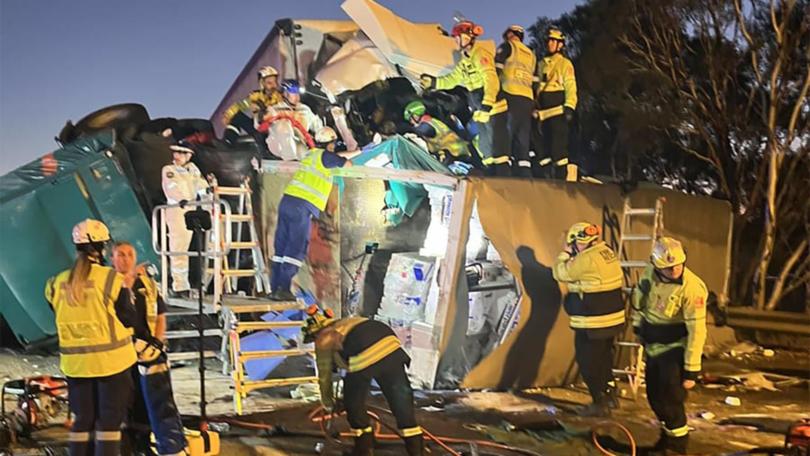 A driver has died after two B-double trucks crashed on the Hume Highway near Canberra. (HANDOUT/NSW FIRE AND RESCUE)