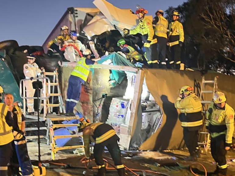 A driver has died after two B-double trucks crashed on the Hume Highway near Canberra. (HANDOUT/NSW FIRE AND RESCUE)