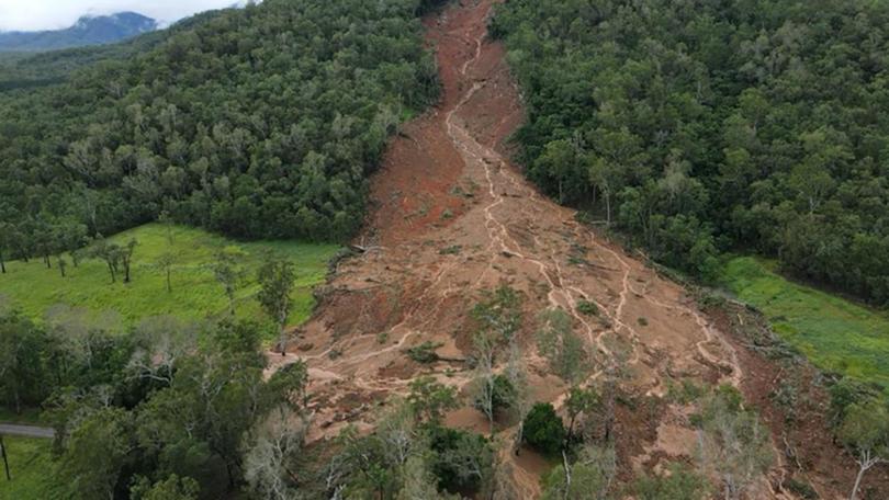 A family were lucky to escape a massive landslide, triggered by heavy rain. (HANDOUT/AARON PIKE)