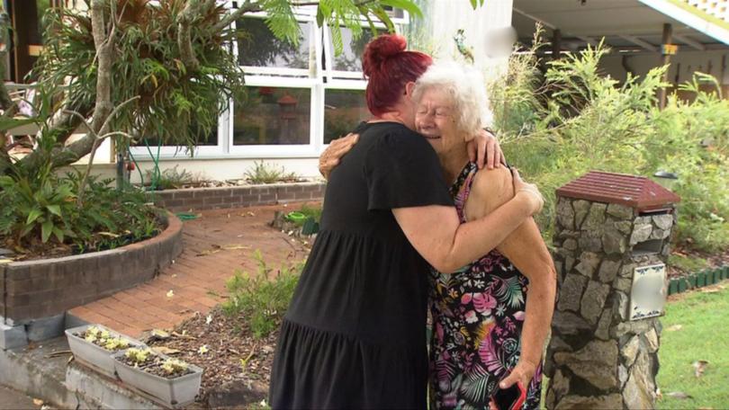 Joanna ‘Jopie’ de Loryn and her neighbour Catherine Armes embrace outside Jopie’s home in Holland Park West.