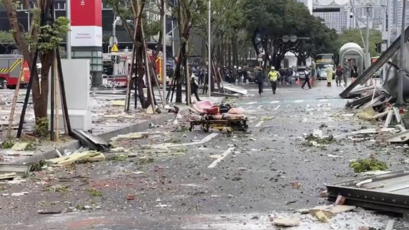 Debris was strewn across the streets in the aftermath of an explosion at a store in Taichung city. 