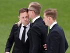 Joel Selwood, Adam Selwood and Scott Selwood embrace during Troy Selwood's funeral Service at GMHBA Stadium.