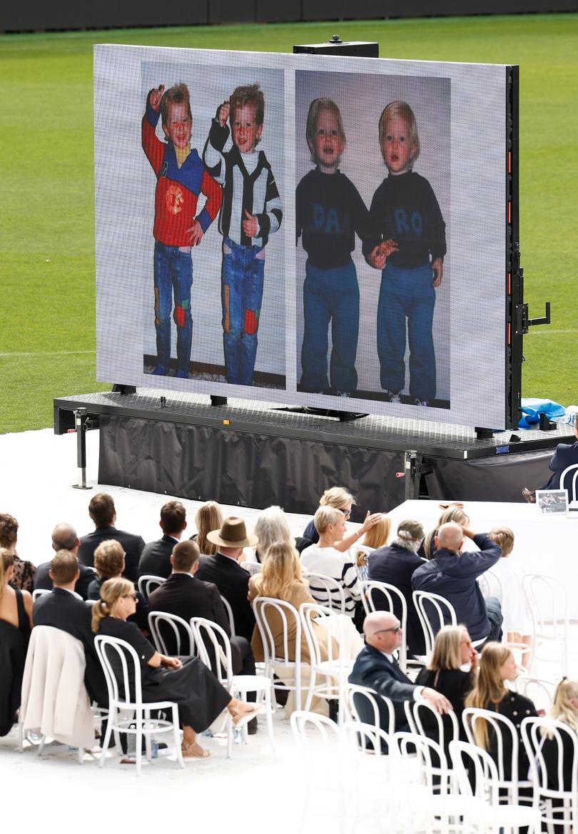 A video tribute is played during Troy Selwood's funeral Service at GMHBA Stadium.