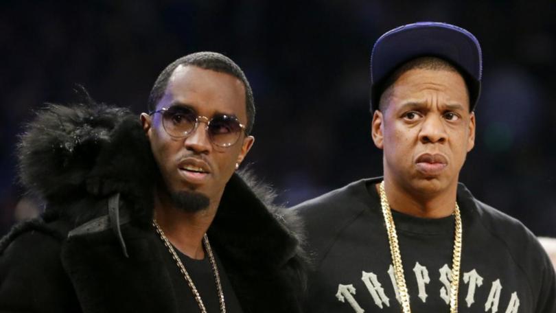 US rappers Sean 'Diddy' Combs (left) and Jay-Z had been accused of raping a woman in 2000. (AP PHOTO)