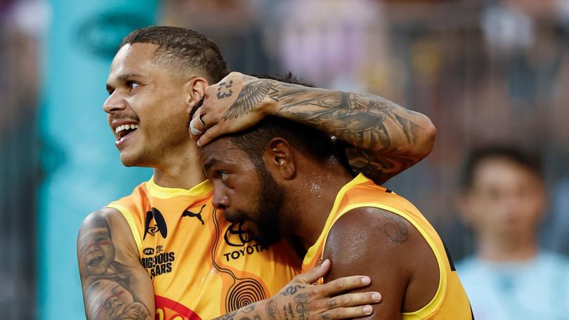 Bobby Hill (left) and Willie Rioli celebrate.