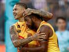 Bobby Hill (left) and Willie Rioli celebrate.