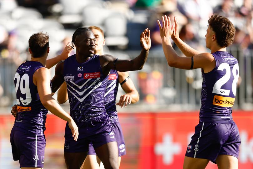 PERTH, AUSTRALIA - FEBRUARY 15: Michael Frederick of the Dockers celebrates a goal with teammates during the 2025 Toyota AFL Indigenous All Stars match between the Indigenous All Stars and the Fremantle Dockers at Optus Stadium on February 15, 2025 in Perth, Australia. (Photo by Dylan Burns/AFL Photos via Getty Images)