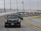 President Donald Trump rides in the presidential limousine for s a pace lap ahead of the start of the NASCAR Daytona 500.