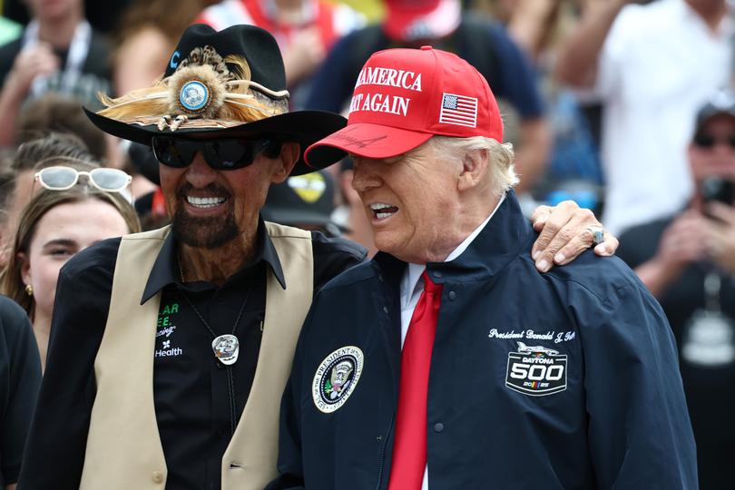 US President Donald Trump is greeted by NASCAR Hall of Famer, Richard Petty prior to the NASCAR Cup Series Daytona 500.