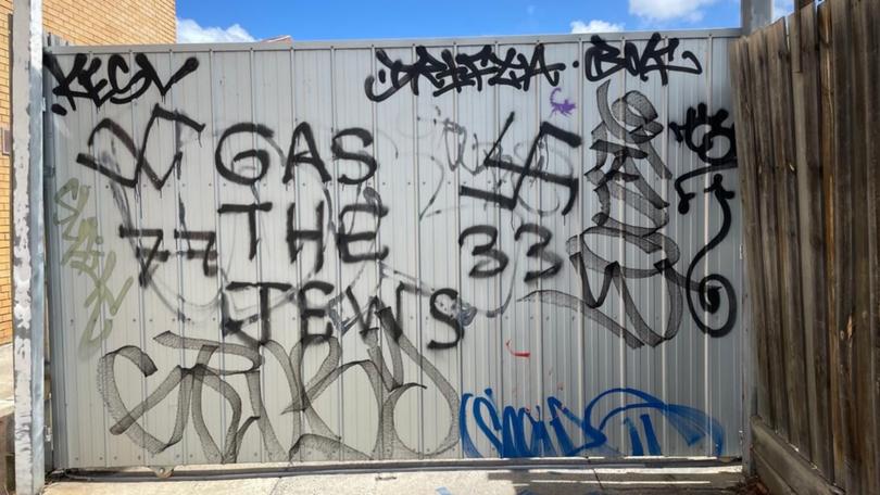 Anti-Semitic graffiti discovered on the wall of a recently closed-down Jewish-run business.