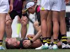 Sam Lalor is attended to by Richmond medical staff during the trial match against West Coast. (Richard Wainwright/AAP PHOTOS)