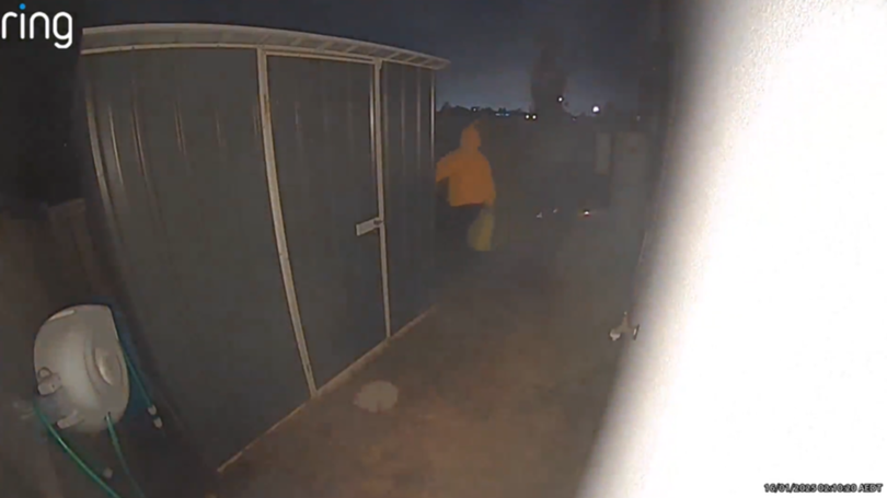 A ring camera connected to the townhouse captured a man holding a jerry can.