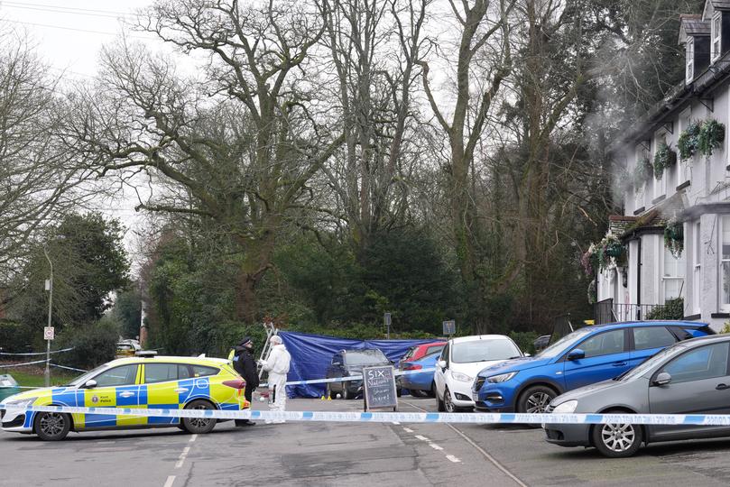 A forensic officer outside the Three Horseshoes pub in Knockholt.