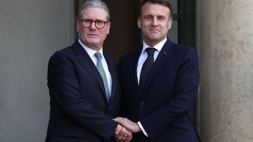 French President Emmanuel Macron welcomes British Prime Minister Keir Starmer during a meeting on the situation in Ukraine at the Elysée Palace in Paris.