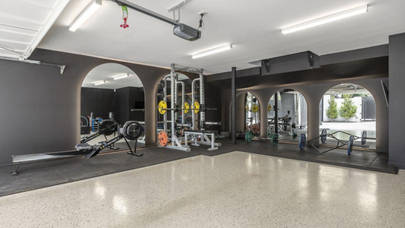 The private gym overlooks the pool.