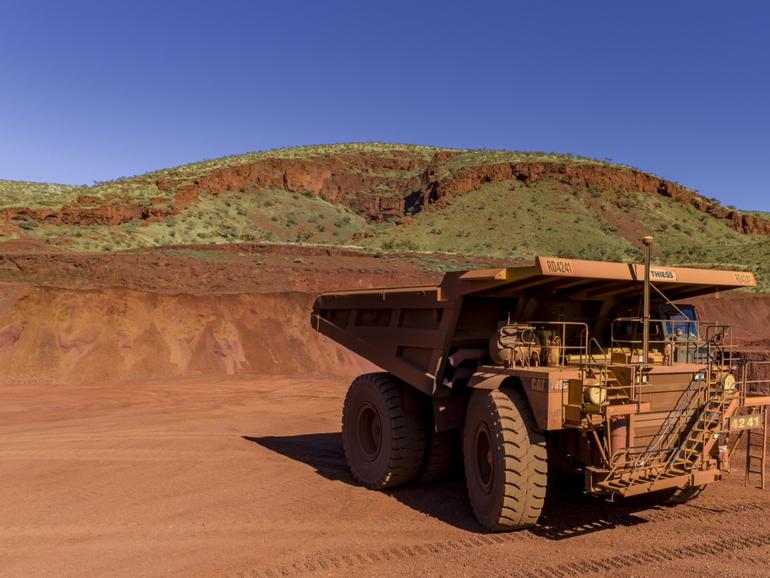 The group has indicated it will pull back spending in iron ore and green energy plans. 

