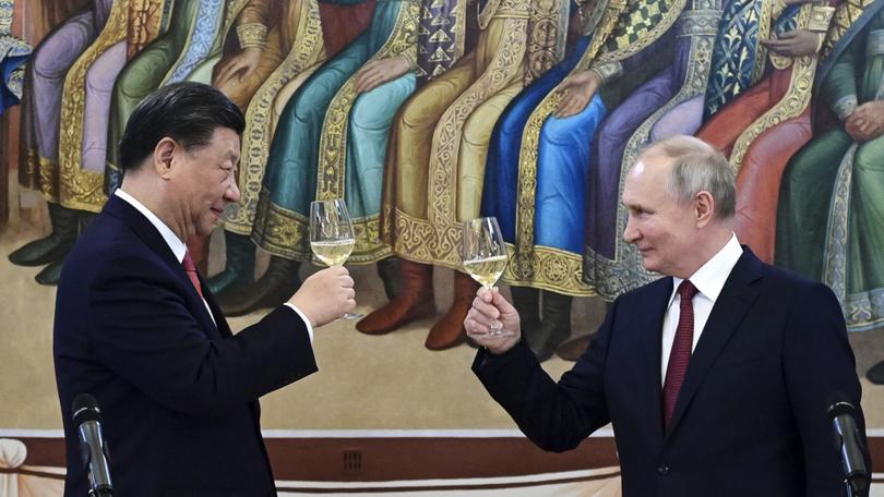 Russian President Vladimir Putin with Chinese President Xi Jinping.  