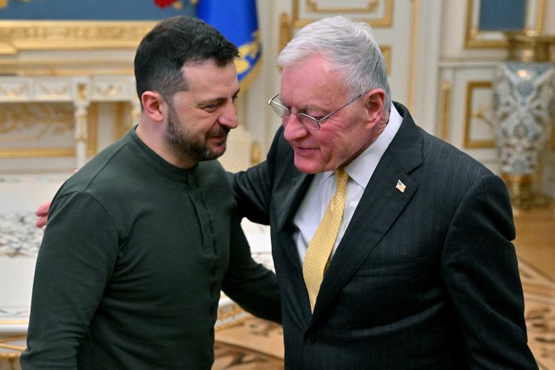 Ukraine's President Volodymyr Zelensky (L) greets US envoy Keith Kellogg at his offices in Kyiv on February 20, 2025.