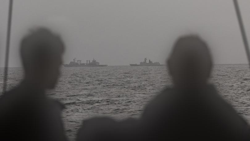 Royal Australian Navy sailors on HMAS Arunta keeping watch on People's Liberation Army-Navy (PLA-N) Fuchi-class replenishment vessel Weishanhu and Jiangkai-class frigate Hengyang in the Tasman Sea. 