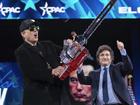 Elon Musk, left, receives a chainsaw from Argentina's President Javier Milei as they arrive speaks at the Conservative Political Action Conference, CPAC, at the Gaylord National Resort & Convention Center, Thursday, Feb. 20, 2025, in Oxon Hill, Md. (AP Photo/Jose Luis Magana)