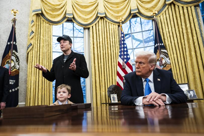 Elon Musk, with his son, X, speaks with President Donald Trump and reporters in the Oval Office on Feb. 11. MUST CREDIT: Jabin Botsford/The Washington Post