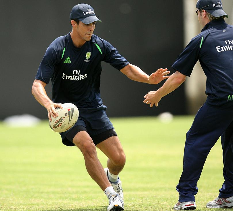 Mitchell Johnson  tries to avoid teammate Michael Clarke (R) during a game of touch rugby in the West Indies in 2007. 